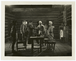 Young George Washington, sent by the Governor of Virginia to warn the French to evacuate the territory claimed by Great Britain, presents a letter to the commandant of Fort Le Boeuf, the French stronghold in the west.