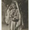 A Palestine peasant girl showing beautifully embroidered costume