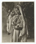 A Palestine peasant girl showing beautifully embroidered costume