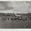 Procession with the bier in a rice field