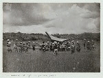 Procession with the bier in a rice field