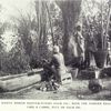 Native women manufacturing palm oil: note the wooden trough like a canoe, full of palm oil