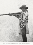 A Gora man firing gun from armpit.