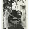 Army Rolling Kitchen. Bread and meat cutting board in use.