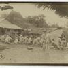 Philippine or Spanish soldiers in action behind barricade.