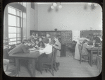 Aguilar [Librarian with children gathered around table]