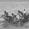 Men diving off of canoes in the Bermuda Islands.]