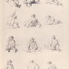 Men sitting on a fence or on the ground