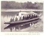 A Chief in his state canoe, Bonny River, Niger Delta.
