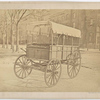 Howard ambulance, front and side view, on city street.