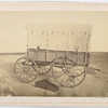 Howard ambulance, side view, wooden box (for limb support) on ground. Background masked.