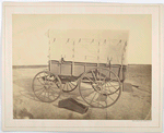 Howard ambulance, side view, wooden box (for limb support) on ground. Background masked.