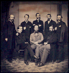 Group of unidentified USSC personnel; three seated in front, five standing in rear