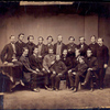 Group of USSC personnel; eight seated in front, ten standing in rear.