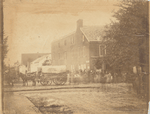 Headquarters U.S. Sanitary Commission Gettysburgh [sic]. [Wagon from “Supply Train 2nd Divn 6th Corps” in front of U.S. Sanitary Commission building, group standing in front of building]