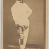 Man exhibits injured right leg in brace with arched foot resting on artificial foot