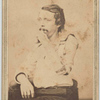[Seated man displays left arm in brace and shoulder harness, his hand raised to mouth] Newark, N.J. : Decamp  Crane, photographers
