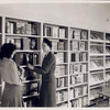 Librarian with young reader in Browsing Room of the Nathan Strauss Branch for Young People