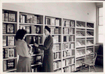 Librarian with young reader in Browsing Room of the Nathan Strauss Branch for Young People