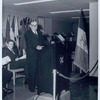 Speaker at podium with WNYC mic, Fordham Branch