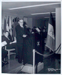 Speaker at podium with WNYC mic, Fordham Branch