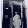 Man entering Bronx Reference Center, Exterior