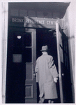 Man entering Bronx Reference Center, Exterior