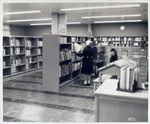 Interior, patrons at bookshelves, Francis Martin Branch