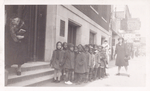 Children in line waiting to go into library