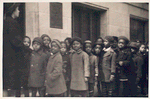 Children in line waiting to go into library