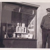 Exterior, window display on Ireland with man standing next to window