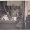 Exterior, two children looking in at window display