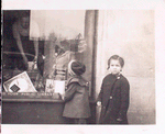 Exterior, children looking in at window display