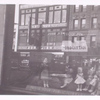 Exterior, window display: Dolls Dressed by Girl Scout Troop 194