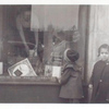 Exterior, children looking in at window display