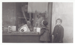 Exterior, children looking in at window display