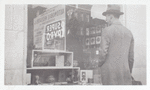 Exterior, man looking in at window display