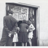 Exterior, people looking in at window display