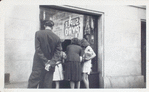 Exterior, people looking in at window display