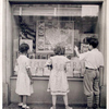 Exterior, children looking in at window display