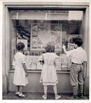 Exterior, children looking in at window display