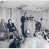 Grand Concourse Dedication: Mayor Wagner, speaking; (l-r) Commissioner Zurmuhlen; Mr. John Mackenzie Cory, Chief of the Circulation Department; Mr. Samuel P. Tolesano, Secretary to Borough President Lyons