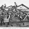 Students framing the roof of a large building