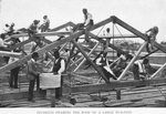 Students framing the roof of a large building