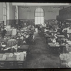 Central Building, Room 100, Miss Ives at her desk, [reversed]