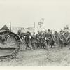 A tank moving up to the front [?]. German prisoners carry wonded to the rear. Close to battleline on the 1st morning of the assault on St. Mihiel Salient. 9-1918.