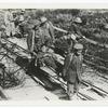 Prisoners carrying wounded to dressing station. Sept. 26, 1918.