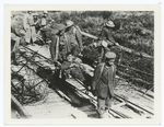 Prisoners carrying wounded to dressing station. Sept. 26, 1918.