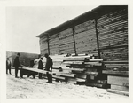Spruce prod. section of Aviation Service Work. Inspecting lumber for further use in airplanes.