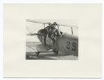 Life of an aviation cadet at Kelly Field, Texas. A cadet climbing into a plane for the first time. Note how awkwardly he bumps his foot against the seat in the plane. (5-1-1918)